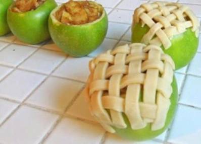 ~APPLE PIE BAKED IN APPLE~
These look so yummy I had to share :-)

 5-6 Granny Smith apples (make sure they can stand on their own) 
 1 tbsp. cinnamon 
 1/4 cup sugar 
 1 tbsp. brown sugar 
 pie crust (homemade or pre-made)

 1) Preheat oven to 375F.

 2) Cut off the top of 4 apples off and discard. Remove the inside of each apple with a spoon or melon baller very carefully, as to not puncture the peel.

 If you’re a skilled interior apple excavator, salvage as much as you can so you can use it for Step 2. I, on the other hand, am not skilled so I just had to throw my interior apples away and chop up additional apples for filling.

 3) Remove skin from remaining apple(s) and slice very thinly. These apple pieces will give you the additional filling needed to fill the four apples you are baking.

 Mix sliced apples with sugars and cinnamon in a bowl. If you prefer more or less cinnamon make adjustments as desired. Same goes for the sugar.

 Scoop sliced apples into hollow apples.

 4) Roll out pie crust and slice into 1/4 inch strips. You can also add a strip of pastry inside the top of the apple almost like a liner to add a little more texture/sweetness to the pie.

 Cover the top of the apple in a lattice pattern with pie crust strips.

 5) Place apples in an 8×8 pan. Add just enough water to the cover the bottom of the pan.

 Cover with foil and bake for 20-25 minutes.

 Remove foil and bake for an additional 20 minutes or until crust is golden brown and sliced apples are soft.

 Makes 4 baked apple pies (in the apple).