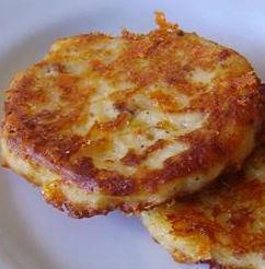 Bacon Cheddar Potato Cakes - made from leftover mashed potatoes

3 slices bacon
4 cups cold leftover mashed potatoes
2 eggs
1 teaspoon onion powder
1/2 teaspoon salt
1/2 teaspoon ground black pepper
1 cup shredded Cheddar cheese

Place the bacon in a large, deep skillet, and cook over medium-high heat, turning occasionally, until evenly browned and crisp, about 10 minutes. Remove the bacon slices, crumble, and set aside. Leave the bacon drippings in the skillet.

Mix the mashed potatoes, eggs, onion powder, salt, and black pepper together in a bowl; stir in the crumbled bacon and Cheddar cheese.

Form the mixture into 8 patties. Heat the bacon drippings over medium heat, and pan-fry the patties in the drippings until crisp on each side, about 4 minutes per side.