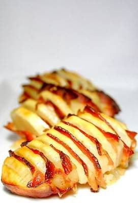 All you do is peel whole potatoes, cut them all across, not too thin, and not all the way through, sprinkle with some salt, but not too much, the bacon is salty. Then fill with small bacon slices in between. Bake in a pan with some oil until potatoes are fully cooked, and serve!

More recipes: http://MyHoneysPlace.com