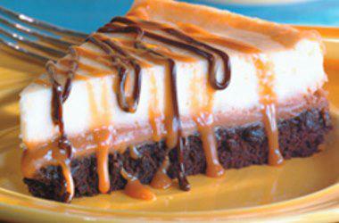 Brownie Caramel Cheesecake = Be sure to click on SHARE to save this to your wall. 

Ingredients
1 (9 ounce) package brownie mix
1 egg
1 tablespoon cold water
1 (14 ounce) package individually wrapped caramels, unwrapped
1 (5 ounce) can evaporated milk
2 (8 ounce) packages cream cheese, softened
1/2 cup white sugar
1 teaspoon vanilla extract
2 eggs
1 cup chocolate fudge topping
Preparation
Preheat oven to 350 degrees F (175 degrees C). Grease the bottom of a 9 inch springform pan.
In a small bowl, mix together brownie mix, 1 egg and water. Spread into the greased pan. Bake for 25 minutes.
Melt the caramels with the evaporated milk over low heat in a heavy saucepan. Stir often, and heat until mixture has a smooth consistency. Reserve 1/3 cup of this caramel mixture, and pour the remainder over the warm, baked brownie crust.
In a large bowl, beat the cream cheese, sugar and vanilla with an electric mixer until smooth. Add eggs one at a time, beating well after each addition. Pour cream cheese mixture over caramel mixture.
Bake cheesecake for 40 minutes. Chill in pan. When cake is thoroughly chilled, loosen by running a knife around the edge, and then remove the rim of the pan. Heat reserved caramel mixture, and spoon over cheesecake. Drizzle with the chocolate topping