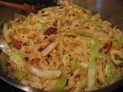 Cabbage & Noodles with Bacon

 1 head of cabbage, chopped
 1 pound of bacon*
 1 large onion, chopped
 2-3 large handfuls of egg noodles*
 Black pepper

 In a large skillet over medium-high heat, cook the bacon until crisp. Remove from the pan and drain on paper towels, then break into bite-sized pieces. (Warning: there’s a chance that you could end up snacking on the bacon bits while you’re finishing dinner. It’s been known to happen here.)

 Meanwhile, bring a large pot of salted water to boil for the egg noodles. Add the noodles and cook until done. Drain the noodles and set aside.

 Drain some of the bacon fat from the pan, reserving enough to cook the onions. Add the chopped onion to the pan and cook for about 1-2 minutes, or until the onions begin to soften. Add the cabbage to the skillet and cook until tender, stirring occasionally. When the cabbage is tender, add the egg noodles and bacon, mixing thoroughly. Season with pepper. Serve immediately.

 *http://bethsblueplate.wordpress.com/2012/10/12/cabbage-noodles/*
