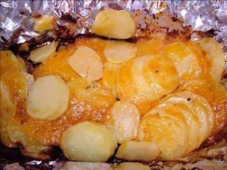 Campfire Potatoes

5 medium potatoes, peeled and thinly sliced
1 medium onion, sliced
6 tablespoons butter or 6 tablespoons margarine
1/2 cup shredded cheddar cheese
2 tablespoons minced fresh parsley
1 tablespoon Worcestershire sauce
salt and pepper
1/3 cup chicken broth
Directions:
1
Place the potatoes and onion on a large piece of heavy-duty foil (about 20"x20"); dot with butter.
2
Combine the cheese, parsley, Worcestershire sauce, salt, and pepper; sprinkle over potatoes.
3
Fold foil up around potatoes and add broth.
4
Seal the foil tightly.
5
Grill, covered, over medium heat for 35-40 minutes or until the potatoes are tender.