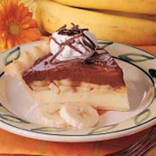 Chocolate Banana Cream Pie Recipe




•1/2 cup sugar
•1/4 cup cornstarch
•1/4 teaspoon salt
•1-1/2 cups milk
•1 cup heavy whipping cream
•3 eggs yolks, lightly beaten
•1 tablespoon butter
•2 teaspoons vanilla extract
•1 pastry shell (9 inches), baked
•4 ounces semisweet chocolate, melted
•2 medium firm bananas, sliced
•Whipped cream and chocolate shavings, optional

Directions
•In a saucepan, combine the sugar, cornstarch and salt. Gradually add milk and cream until smooth. Cook and stir over medium-high heat until thickened and bubbly, about 2 minutes. Add a small amount to egg yolks; mix well. Return all to the pan. Bring to a gentle boil; cook for 2 minutes, stirring constantly. Remove from the heat; stir in butter and vanilla.
 • Pour half into the pastry shell; cover and refrigerate. Add chocolate to remaining custard; mix well. Cover and refrigerate for 1 hour. Do not stir.
 • Arrange bananas over filling. Carefully spoon chocolate custard over all. Refrigerate for at least 2 hours. Garnish with whipped cream and chocolate shavings if desired. Yield: 6-8 servings.
