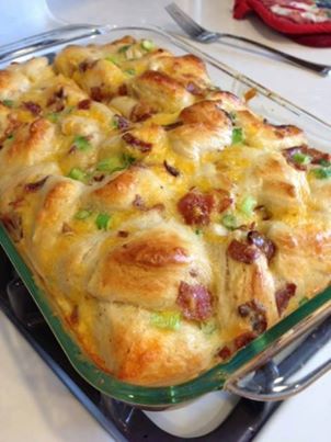 Comfort Breakfast Bake (recipe from Rocking Lion)

5 eggs
1/4 cup milk
16 oz refrigerated breakfast biscuits (I used the Pillsbury flakey kind)
4 scallions (green onions, spring onions, whatever you prefer to call them)
1 cup shredded extra sharp cheddar cheese
If you’re into the meats – cooked center cut bacon or cooked sausage
11×17 pan, sprayed with cooking spray (Note: I think a 9×13 works better, but it might need to bake a little longer)

1. Mix your eggs and milk in a large bowl. Cut each biscuit (I’m all about scissors in the kitchen) into fours and add it to the bowl. I like to do this before I cook the bacon or cut up the scallions – give the biscuits some time to really soak in the eggs.

2. Cut up your scallions, shred your cheese, cook and break up your bacon (or sausage). Add everything to the bowl. 

3. Mix it all up and pour into your pan. Bake at 350 for 25 minutes (make sure it isn't runny – mine this morning took 28 mins).