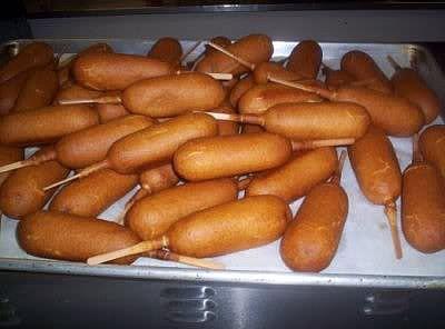 Corn Dogs

½ cup flour 
¾ Tsp. baking powder
1/3 cup cornmeal 
1 Tbsp. sugar
½ Tsp. salt    
½ cup milk
1 egg, beaten
1 Tbsp. cooking oil
4 to 6 hot dogs
4 to 6 wooden sticks

Sift together flour, baking powder, cornmeal, sugar and salt.   Stir together milk, egg and oil.   Beat in dry ingredients.   Skewer each hot dog on wooden sticks.   Dip in batter and fry in hot oil using sticks or tongs.   Drain onto paper towels.

@[100001126562834:2048:Granny's Favorites Cookbooks]