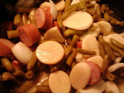 Cow boy stew.

2-3 cans of green beans (we use cheep ones)
2-3 cans of sliced potatoes (same cheap ones)
One onion chinked
One package of Polish sausage.  Chinked.
Garlic salt and pepper to taste.  
Cheep and filling.  We love it. Hope you do to.