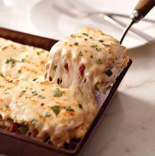 Creamy Chicken Alfredo Lasagna!

Ingredients
2 cups shredded cooked chicken breasts
1 can (14 oz.) artichoke hearts, drained, chopped
1 pkg. (8 oz.) KRAFT Shredded Mozzarella Cheese with a TOUCH OF PHILADELPHIA, divided
1/2 cup KRAFT Grated Parmesan Cheese
1/2 cup chopped drained oil-packed sun-dried tomatoes
2 pkg. (8 oz. each) PHILADELPHIA Cream Cheese, softened
1 cup milk
1/2 tsp. garlic powder
1/4 cup tightly packed fresh basil, chopped, divided
12 lasagna noodles, cooked

Directions
HEAT oven to 350°F.
COMBINE chicken, artichokes, 1 cup mozzarella, Parmesan and tomatoes. Beat cream cheese, milk and garlic powder with mixer until well blended; stir in 2 Tbsp. basil. Mix half with the chicken mixture.
SPREAD half the remaining cream cheese mixture onto bottom of 13x9-inch baking dish; cover with 3 noodles and 1/3 of the chicken mixture. Repeat layers of noodles and chicken mixture twice. Top with remaining noodles, cream cheese mixture and mozzarella; cover.
BAKE 25 min. or until heated through. Sprinkle with remaining basil. Let stand 5 min. before cutting to serve.
