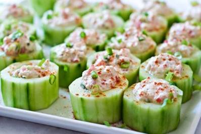 Healthy and Fresh Recipes
Taking an appetizer to a dinner party or picnic this weekend? If so, here's a great recipe to try that travels well too. Cucumber Cups Stuffed with Spicy Crab courtesy of DomesticFits.com

INGREDIENTS

3 long cucumbers
1/4 cup sour cream (use reduced fat for lower-cal version)
1/4 cup cream cheese, softened (use reduced fat for lower-cal version)
3/4 cup crab meat, excess water removed
1 tsp hot pepper sauce (Tabasco or tapito)
1 tsp brown mustard
Salt and pepper to taste
1 tbs minced green onion
Garnish with chili powder or paprika if desired
INSTRUCTIONS

Remove the peel from the cucumbers using a vegetable peeler. Cut the cucumber into 2 inch slices. Using a small melon baller, scoop out most of the inside. You want to leave the walls and a thick portion of the bottom intact.
In a bowl, combine the sour cream and the cream cheese with a fork until well combined. add the remaining ingredients and stir until combined. Fill each of the cucumber cups with the crab dip. Refrigerate until ready to serve. Serve within 2 hours of making.
Experiment with different dips in the cucumber cups like hummus or a Greek yogurt spread. Enjoy!