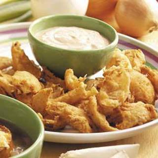 Deep-Fried Onions with Dipping Sauce Recipe




Ingredients
•1 sweet onion
•1/2 cup all-purpose flour
•1 teaspoon paprika
•1/2 teaspoon garlic powder
•1/8 teaspoon cayenne pepper
•1/8 teaspoon pepper
•BEER BATTER:
•1/3 cup all-purpose flour
•1 tablespoon cornstarch
•1/2 teaspoon garlic powder
•1/2 teaspoon paprika
•1/4 teaspoon salt
•1/4 teaspoon pepper
•7 tablespoons beer or nonalcoholic beer
•Oil for deep-fat frying
•DIPPING SAUCE:
•1/4 cup sour cream
•2 tablespoons chili sauce
•1/4 teaspoon ground cumin
•1/8 teaspoon cayenne pepper

Directions
•Cut onion into 1-in. wedges and separate into pieces. In a shallow bowl, combine the flour, paprika, garlic powder, cayenne and pepper.
 • For batter, in another shallow bowl, combine the flour, cornstarch, garlic powder, paprika, salt and pepper. Stir in beer. Dip onions into flour mixture, then into batter and again into flour mixture.
 • In an electric skillet or deep-fat fryer, heat oil to 375°. Fry onions, a few at a time, for 1-2 minutes on each side or until golden brown. Drain on paper towels. In a small bowl, combine the sauce ingredients. Serve with onions. Yield: 2 servings.