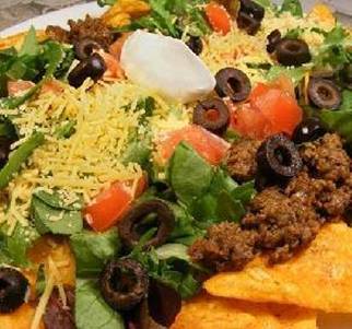 Doritos Taco Salad
Source: Metabolic Cooking Book http://tiny.cc/Metabolic

1 lb hamburger
1 (1 1/4 ounce) packet taco seasoning
3/4 cup water
1 (13 ounce) bag Doritos
2 cups shredded cheddar cheese
shredded lettuce
chopped tomato
Directions:

1. Cook crumbled hamburger until no longer pink. Add taco seasoning and water and cook according to the taco seasonings directions.
2. Put Doritos on four plates (as little or as much as you like). Top with finished cooked hamburger. Sprinkle with cheddar cheese (again, as much or as little as you like). Top with shredded lettuce and tomatoes. If there are other taco toppings you like, add them too.