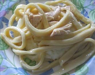 Favorite Homemade Chicken and Noodles






3 boneless skinless chicken breasts 
5 (14 1/2 ounce) cans fat free chicken broth 
4 cups water 
1 tablespoon salt 
pepper (optional) 6 egg whites 
1 egg yolk 
3 cups flour 
3 teaspoons salt 
6 tablespoons milk or 6 tablespoons water 
salt and pepper 
1 -2 cup flour (set aside to use while rolling out the noodles) 
Directions:
1
Put chicken breasts and water and salt and pepper in dutch oven/stew pot to boil.
2
(Continue to low boil until noodles are made).
3
Mix remaining ingredients (mixing by hand is the best way).
4
Add flour (if needed) until you get firm not hard ball.
5
Roll out on floured pastry sheet or where ever you roll out dough.
6
Keep flouring and flipping dough till you have the thickness you desire (I recommend 1/8-inch).
7
Flour flat dough then roll up.
8
Cut to thickness desired (I recommend 5/8-inch).
9
Before unrolling the strips, sprinkle flour on them, unroll them and add more flour mix them together, place noodles and all the flour in a bowl.
10
Let set.
11
Remove the chicken from the pot and cut into chunks or strips.
12
Add the canned broth to the water.
13
Bring to boil, add the noodles, remaining flour and the chicken to the pot stir well, bring to boil then simmer stirring often.
14
Done in about an hour.
15
Wonderful served over mashed potatoes.