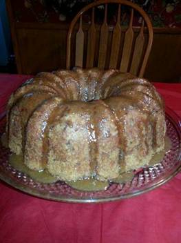 This apple cake is not only delicious, it's easy to make. Grease and flour a tube cake pan and preheat oven to 350 degrees.

Fresh Apple Cake
3 eggs
1 1/4 cup oil
2 cups sugar
2 1/2 cups self-rising flour
2 medium apples, peeled, cored and chopped
1 cup shredded coconut
1 cup chopped walnuts or pecans
1 tsp. cinnamon

Blend eggs, oil and sugar until creamy. Add flour a little at a time. Blend well. Batter will be stiff. Fold in apples, coconut and nuts. Pour into tube pan and bake for 1 hour. Remove from pan after about 30 minutes.

Top warm cake with the following:
1/2 stick butter
1/2 cup brown sugar
1/3 cup milk
Mix butter, sugar and milk in saucepan. Boil for 3 minutes, pour over warm cake.

I got this from a Good Friend Cookie Russell

******
