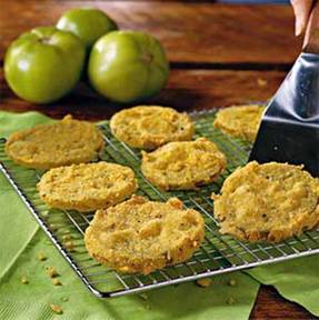 Have YOU ever tried Fried Green Tomatoes?

Here is a Southern classic! Making these delicious treats isn't as hard as everyone thinks, but make sure you buy good local produce for the best flavor! (or grow your own)

Fried Green Tomatoes

1 large egg, lightly beaten 
1/2 cup buttermilk
1/2 cup all-purpose flour, divided
1/2 cup cornmeal
1 teaspoon salt
1/2 teaspoon pepper
3 medium-size green tomatoes, cut into 1/3-inch slices
Vegetable oil
Salt to taste

Preparation

Combine egg and buttermilk; set aside.
Combine 1/4 cup all-purpose flour, cornmeal, 1 teaspoon salt, and pepper in a shallow bowl or pan.
Dredge tomato slices in remaining 1/4 cup flour; dip in egg mixture, and dredge in cornmeal mixture.
Pour oil to a depth of 1/4 to 1/2 inch in a large cast-iron skillet; heat to 375°. Drop tomatoes, in batches, into hot oil, and cook 2 minutes on each side or until golden. Drain on paper towels or a rack. Sprinkle hot tomatoes with salt.