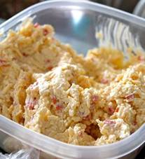 HOMEMADE PIMENTO CHEESE 
I'm making this to take on vacation this weekend for lunches on the beach!  So good!
This is one delicious recipe; full flavored, not bland like some of the store bought pimento cheeses.  Pack a few of these in zip bags the next time you pack a cooler and go to the beach or a game.  You will be glad you did.  You can also use this for grilled cheese sandwiches or on toasted bread sandwiches.
You Will Need:

    2 Cups of Sharp Cheddar
    8 oz. of softened Cream Cheese
    1/2 Cup of Mayo
    1/4 Teaspoon Garlic Powder
    1/4 Teaspoon of Onion Powder
    1 Jalapeno Pepper, seeded and minced  (more or less to taste)
    1 (4 oz.) Jar of Pimento, drained
    Salt & Black Pepper (to taste)
 

Instructions:
    Put all the ingredients in a bowl together and mix on medium speed with a mixer until mixed together well. 


Tips:
    I like to mix everything together without the shredded cheese and then add the cheese shred and mix again. 
    You can eat it right away or store it covered in the fridge for sandwiches or dip over the next couple of days.
    Toast a couple of slices of bread and make a warm toasted pimento cheese sandwich to go along with soup for dinner.

Julie Branstetter
FOR MORE RECIPES VISIT MY BLOG AT WWW.KCMIN.COM
Enjoy!!
