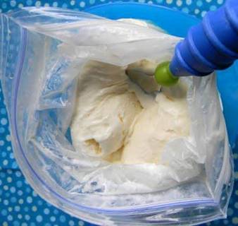 Ice Cream In A Bag Less Than 10 minutes   :D

This is old I remember doing this back in school when I was little and when I do it with my kids they are amazed how fast it is lol 

Here is what you will need to make homemade ice cream in a baggie:

2 Tablespoon sugar
1 cup half & half (or light cream)
1/2 tsp vanilla extract
1/2 cup coarse salt or table salt(I used canning salt)
ice
gallon-sized Ziploc bag
pint-sized Ziploc bag



Mix the sugar, half & half and vanilla extract together. Pour into a pint-sized Ziploc baggie. Make sure it seals tightly.



Now take the gallon-sized Ziploc bag and fill it up halfway with ice and pour the salt over the ice. Now place the cream filled bag into the ice filled bag and seal.



Make sure it is sealed tightly and start shaking. Shake for about 5 minutes (or 8 minutes if you use heavy cream.)



Open the gallon-sized bag and check to see if the ice cream is hard, if not keep shaking. Once the ice cream is finished, quickly run the closed pint-sized baggie under cold water to quickly clean the salt off the baggie.



Open the baggie and pop in a spoon.


Hope you enjoy your homemade ice cream in a baggie as much as we do!

✔ Like ✔ “Share” ✔ Tag ✔ Comment ✔ Repost ✔
Follow ... @[363231383746302:69:Sherry's Skinny Friends]