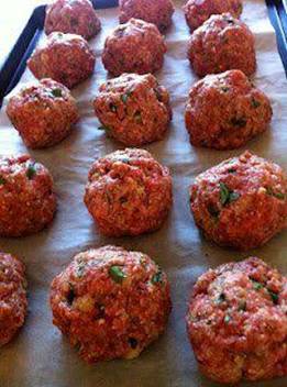 Incredible Baked Meatballs.

1 lb hamburger
2 eggs, beaten with 1/2 cup milk
1/2 cup grated Parmesan
1 cup panko or bread crumbs
1 small onion, minced
2 cloves garlic, minced
1/2 teaspoon oregano
1 teaspoon salt
freshly ground pepper to taste
1/4 cup minced fresh basil

Mix all ingredients with hands.
Form into golfball sized meatballs.
Bake at 350 degrees for 30 minutes.