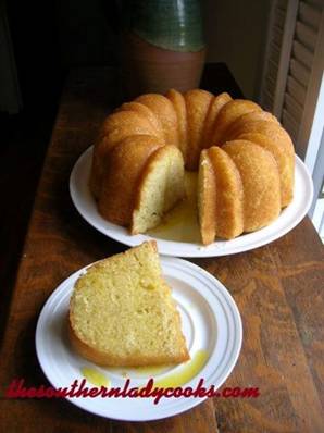 KENTUCKY BUTTER CAKE WITH RUM SAUCE


2 cups sugar
4 eggs
2 sticks butter, softened
2 teaspoons rum, can use more(If you don’t use alcohol, you can substitute vanilla extract or rum extract)
1 cup buttermilk
3 cups all-purpose flour
1 teaspoon salt
1 teaspoon baking powder
1/2 teaspoon baking soda
 
In a large bowl cream sugar, eggs, butter, and buttermilk together with mixer.  Add flour, salt, baking powder, baking soda, and vanilla or rum and mix.  Pour batter into a well-sprayed bundt pan or pan of your choice.  Bake in a preheated 325 degree oven for 55 to 60 minutes until done.  Let cool in the pan at least 30 minutes before removing. 
 
Rum Sauce                                                                          
3/4 cup sugar
1/3 cup butter
3 tablespoons water
2 teaspoons rum, can use more (If you don’t use alcohol, you can substitute vanilla extract or rum extract)
 
Combine all ingredients in a saucepan and cook over medium heat until fully melted.  Do not boil!   Pour over cake.  (Note:  I take a skewer and poke holes in the cake, then use a turkey baster to put sauce into holes but you can just pour it over the cake)  The cake will soak up the sauce.   YUMMY!   Enjoy!
http://thesouthernladycooks.com/2012/04/30/kentucky-butter-cake-with-rum-sauce/