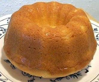I've been using this recipe for 20+ years. It's the best!!

Moist Old-Fashioned Pound Cake

3 ½ cups cake flour (sifted) (I use Swans Down or Softasilk)

3 cups sugar

2 sticks butter or margarine

1 cup Crisco (shortening)

1 cup milk

5 large eggs

1 tsp. vanilla extract

1 tsp. lemon extract

 
Blend sugar, butter and Crisco together with mixer.  Add flour and milk alternately blending mixture well. Add eggs, one at a time, and mix thoroughly. Add vanilla and lemon extract and mix again. 

Grease and flour 9 inch tube pan, add batter and bake at 325 degrees for 1 ½ hours.  DO NOT OPEN OVEN.