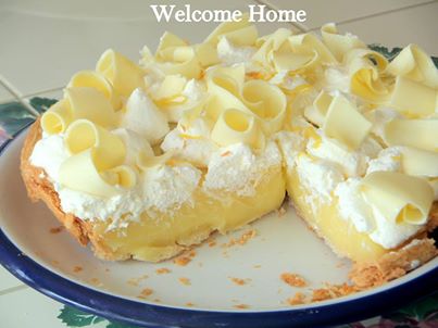 As promised earlier, here is my Mom's Lemon Cream Pie. I have been wanting to make this for quite some time and now I'm sorry I didn't make it years ago. This pie will be my favorite from this day forward.  An awesome creamy...almost velvety pie with a custard like filling and just a hint of tartness that goes beautifully with the whipped cream.  I added a special garnish of white chocolate curls that made this pie the best pie I have ever eaten!  

Mom's Lemon Cream Pie

Pie Shell:  I made my Mom easy pie shell recipe, but you can buy a ready made frozen pie shell if you need to save time.

4 cups flour
1 tablespoon sugar
1 tablespoon salt
1 3/4 cup Crisco Shortening
1 tablespoon vinegar
1 egg
1/2 cup water

This recipe makes 4 pie dough rounds. One for now and three to freeze for later. Mix flour, sugar, and salt. Cut-in the shortening with a fork or cutting tool.  In a separate bowl mix vinegar, egg, and water. Add it to the flour mixture, stirring with a fork until moistened. Use your hands to mold into 4 equal balls. Use one now for your pie and freeze the others for future use.

Flour your surface and roll the crust starting from the middle and moving out, till it’s about 2 inches larger than the size of your pie dish. Try to work quickly and handle it as little as possible so it doesn't get tough. Gently roll your dough around your rolling pin and lay it in the pan. Then unroll the crust, and gently fit it in-place–don’t pull or tug on the crust. Use a knife to trim the uneven edges, leaving about a 1-inch overhang. Tuck the overhang under on the edge of your pan. Then use your fingers to pinch the edges for a decorative finish.  Bake at 350 until golden brown.  Cool completely before adding filling.

Lemon Cream Filling

1 cup sugar
3 ½  tablespoons cornstarch
1 tablespoon grated lemon zest
1/4 cup fresh lemon juice
3 egg yolks slightly beaten
1 cup whole milk
¼ cup frozen butter
1 cup sour cream

Combine sugar, cornstarch, lemon zest, lemon juice, egg yolks and milk in sauce pan, and cook over med heat until thick. Stir in the frozen butter and cool to room temp. Stir in the 1 cup of sour cream and Pour into pie cooked shell. 

Whipped Cream and White Chocolate Topping:
1 cup whipping cream
2 tablespoons powdered sugar
Shaved White Chocolate Curls

Right before you are ready to serve your pie, place the whipping cream and powdered sugar in a large bowl (or stand mixer) and beat with an electric mixer until stiff peaks form and you have whipped cream.  Dollop the cream on top of the pie.  Shave the white chocolate to garnish top...I used a cheese slicer.  Serve and enjoy!

Photo property of ©Welcome Home 2013