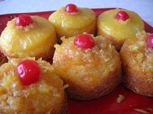 PINEAPPLE UPSIDE DOWN CUPCAKES! 

Ingredients
1 box Pillsbury Moist Supreme Classic Yellow Cake Mix with pudding in the mix
1 (3.4 ounce) Vanilla Instant Pudding
3 eggs
1/3 cup oil
2/3 cup pineapple juice
1/3 cup milk
1 (8 ounce) can pineapple slices, drained (save juice)
1 (8 ounce) can crushed pineapple, drained (save juice)

Topping
1 stick butter, melted
1 cup brown sugar
maraschino cherries

Spray muffin tins well with cooking spray. Melt butter and sugar together on top of the stove. Add 1 tablespoon sugar mixture to each muffin cup. Next, put in 1 tablespoon crushed, drained pineapple or 1 pineapple slice in bottom of each cup. In a large bowl mix cake mix, pudding mix, eggs, oil, juice and milk with mixer. Fill cups 1/2 to 3/4 full with cake mix. Bake in preheated 350 degree oven for 25 minutes. Remove and let cool at least 10 minutes. Run a knife around the edges to loosen muffins from cups before removing. Turn cupcakes upside down on a platter and add cherries. Note: I used one regular 12 cup muffin tin and one large 6 cup tin to make these. This way the recipe made 18 cupcakes.. If just using regular 12 cup tins, it should make about 24 cupcakes. You could use all crushed pineapple or all pineapple rings as well. I wanted to try them both ways to see how they turned out. I think the pineapple rings work better in the larger cup muffin tins.) These would be good topped with whipped cream and you could add nuts to the mix.