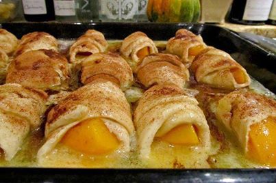 Peach Dumplings - Oh My Gosh, I've died and gone to heaven!!!
*To Save this recipe, simply Share it to your timeline*

Ingredients:
2 whole large peaches
2 8 oz cans crescent rolls
2 sticks butter
1-1/2 cup sugar
1 tsp vanilla
cinnamon, to taste
1 12 oz can Mountain Dew

Peel and pit peaches. Cut both peaches into 8 slices. Roll each peach slice in a crescent roll. Place in a 9 x 13 buttered pan.
Melt butter, then add sugar and barely stir. Add vanilla, stir, and pour entire mixture over peaches. Pour Mountain Dew around the edges of the pan. Sprinkle with cinnamon and bake at 350 degrees for 40 minutes. Serve with ice cream, and spoon some of the sweet sauces from the pan over the top.