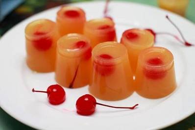 Pineapple Upside Down Cake Jello Shots

Ingredients

3/4 cup (180 mL) boiling water
1 3-ounce box pineapple Jello gelatin
1/4 cup (60 mL) cold water
1/2 cup (120 mL) vodka
1/4 cup (60 mL) butterscotch schnapps
1/4 cup (60 mL) Irish cream

1. Dissolve the gelatin into the boiling water in a large bowl.

2. Measure and pour the schnapps, vodka, Irish cream, and cold water into the bowl. Thoroughly stir until well mixed. Allow the mixture to cool a little.

3. Add a maraschino cherry in plastic shot cups.

4. Carefully pour the Jello mixture over the cherries.

5. Chill in the refrigerator to allow the mixture to fully set and harden.