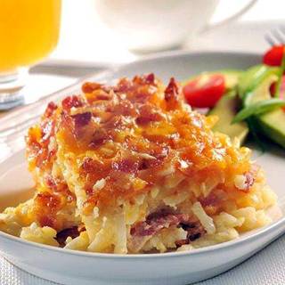 Potato Bacon Casserole 

4 cups frozen shredded hash brown potatoes
1/2 cup finely chopped onion
8 ounces bacon or turkey bacon, cooked and crumbled
1 cup (4 oz.) shredded cheddar cheese
1 can (12 fl. oz.) evaporated milk
1 large egg, lightly beaten or 1/4 cup egg substitute
1 1/2 teaspoons seasoned salt
Directions 
PREHEAT oven to 350° F. Grease 8-inch-square baking dish. 

LAYER 1/2 potatoes, 1/2 onion, 1/2 bacon and 1/2 cheese in prepared baking dish; repeat layers. Combine evaporated milk, egg and seasoned salt in small bowl. Pour evenly over potato mixture; cover. 

BAKE for 55 to 60 minutes. Uncover; bake for an additional 5 minutes. Let stand for 10 to 15 minutes before serving. 

http://www.verybestbaking.com/recipes/29566/Potato-Bacon-Casserole/detail.aspx