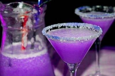 Purple Dragon  Martini

Ingredients:
3oz vodka
1 1/2oz cranberry juice
1/2oz blue Curacao liqueur
1/2oz sweet and sour mix
1/2oz of 7-Up
2-3 ice cubes

Directions 
 in blender or food processor all  ingredients and blitz 20 to 30 seconds on high speed.
Salt the rim of your martini glass

Pour and Enjoy