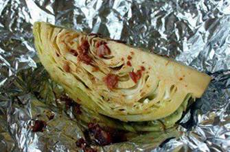 Roasted cabbage. INSANELY delicious, easy, inexpensive & healthy ~Frisky

1 tsp olive oil (5g)
2 tbsp real bacon bits (14g)
2 tbsp lemon juice
1 tbsp worcestershire sauce
1/4 tsp kosher salt
1/4 tsp ground black pepper (more or less to taste)
1 Medium Head of Cabbage
Preheat the oven (or the grill,) to 425 degrees.

Mix the olive oil, bacon bits, lemon juice, worcestershire sauce, salt and pepper to make the marinade.



Prepare the cabbage. Rinse it under water and remove any yucky loose leaves.

Cut the head in half on the core..



Then cut the halves in half again…



…to make quarters.



Lay each wedge on a sheet of aluminum foil large enough to wrap it up in. Spoon about 2 tbsp of the marinade on top making sure to get it in all the nooks and crannies.



Wrap each wedge and bake for 20-30 minutes.



I say 20-30 becuase they will continue to cook once you pull them out and I like mine still crunchy. So I let them sit for a little while pull them out around the 20 minute mark. However, some like to cook them up to an hour for softer cabbage.



The wedges reheat wonderfull in the oven or the microwave! 

To SAVE this , be sure to click SHARE so it will store on your personal page.
For more amazing ideas... recipes and motivational weight loss tips follow me or friend me