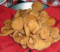 Rocky Mountain Oysters....
2 lbs bull testicles	 (calf, lamb, sheep, or turkey testicles can also be used)
2 tablespoons salt
1 tablespoon vinegar
1 cup flour
1/4 cup cornmeal
salt
pepper
garlic powder
bottled hot sauce
cooking oil (for frying) or fat	 (for frying)
Directions...........

Split the tough skin-like muscle that surrounds each "oyster" (use a sharp knife). You can also remove the skin easily if the meat is frozen and then peeled while thawing.

Soak in a pan of salt water one hour; drain.

Transfer to a large pot and add enough water to float the meat.

Add the vinegar to the pot.

Parboil, drain and rinse.

Let cool and slice each oyster into 1/4 inch thick ovals or as thin or thick as you like..

Sprinkle salt and pepper on both sides of sliced oyster to taste.

Combine flour, cornmeal and some garlic powder/salt/pepper

Roll each slice into flour mixture.

Dip into milk.

Roll again into flour mixture.

Fry in hot oil till golden brown..Cocktail sauce is good if you like it.