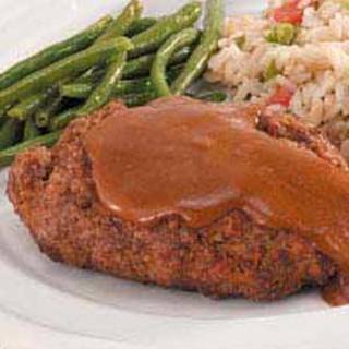 Salisbury Steak Recipe




Ingredients
•1 egg
•1/4 cup 2% milk
•1/4 cup dry bread crumbs
•1 envelope brown gravy mix, divided
•1 teaspoon dried minced onion
•1/2 pound lean ground beef (90% lean)

•1/2 cup water
•1 tablespoon prepared mustard

Directions
•In a large bowl, whisk egg and milk. Add the bread crumbs, 1 tablespoon gravy mix and onion. Crumble beef over mixture and mix well. Shape into two patties, about 3/4 in. thick. Place in a small baking pan.
 • Broil 3-4 in. from the heat for 6-7 minutes on each side or until a thermometer reads 160° and juices run clear.
 • Place the remaining gravy mix in a small saucepan; stir in water and mustard. Bring to a boil; cook and stir until thickened. Serve with patties. Yield: 2 servings.