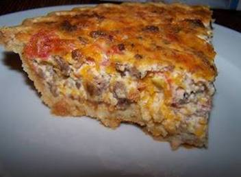 Sausage Quiche 

1/2 pound Williams Sausage
1 1/2 cups shredded cheddar cheese
1 can Rotel tomatoes, drained 
2 eggs
1/4 cup Ranch dressing
1/4 cup sour cream
1/3 cup milk
1 9-inch unbaked deep dish pie shell

Preheat oven to 350. In a large skillet, cook sausage until well browned, stirring frequently. Drain off grease and set aside. Whisk together eggs, Ranch dressing, sour cream and milk. Add sausage, cheese and Rotel. Stir to combine. Pour egg mixture into prepared pie crust. Bake 1 hour. Allow quiche to rest for 5-10 minutes before serving.