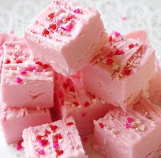** STRAWBERRY FUDGE**


INGREDIENTS:

1 16 oz can of strawberry frosting
1 12 oz bag of white chocolate chips
2/3 cup chopped pecans

DIRECTIONS:

Lightly spray an 9×9 pan ( or a 9 x 13 pan for thinner bars ) with cooking spray. 

Put chocolate chips in microwave safe bowl and melt them,( not letting them burn)  You could also use a double boiler.

Stir in entire can of strawberry frosting.

Stir in pecans. 

Spread into pan and chill in refrigerator for 30 minutes.

Cut into squares and serve.