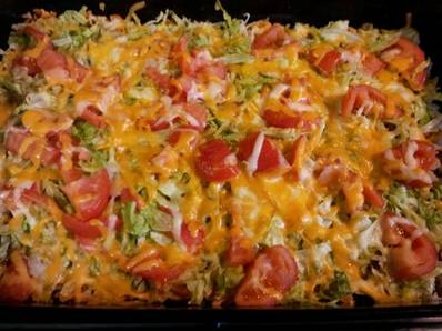 Taco Casserole
1 7oz. bag Nacho Cheese Doritos, crushed
1 lb. hamburger, browned
1 pkg. taco seasoning, mixed according to directions
1 (8 oz.) pkg. shredded Cheddar cheese
1 (8 oz.) pkg. shredded Mozzarella cheese
Shredded Lettuce
Sliced tomato

Layer ingredients in 9 x 13 pan as listed - crushed chips, meat and seasonings, 2/3 of cheese, lettuce, tomato, and remaining cheese.  Bake at 350 degrees for 15 minutes.