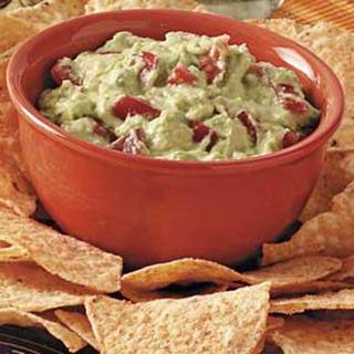 Tomato Guacamole Dip Recipe

Prep/Total Time: 15 min.
Yield: 8-10 Servings

Ingredients
2 medium ripe California Avocados, peeled and chopped
1 tablespoon lime juice
1 small tomato chopped
3 tablespoons sour cream
1/2 teaspoon salt
1/2 teaspoon minced garlic
Tostito chips

Directions
In a small bowl, mash avocados and lime juice with a fork. Stir in the tomato, sour cream, salt and garlic. Cover and refrigerate for 5 minutes. Serve with Tostito chips. Yield: 2-1/3 cups.