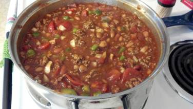 Photo: Wendy's Chili Recipe Ingredients:

.1 onion, chopped 
1 bell pepper, chopped 
1 (14 ounce) can stewed tomatoes 
4 (8 ounce) cans tomato sauce 
1 (14 ounce) can ranch style beans 
1 (14 ounce) can pinto beans 
1 (14 ounce) can kidney beans 
1 (10 ounce) can Rotel diced tomatoes 
1 (1 1/4 ounce) package McCormick mild chili seasoning 
2 lbs ground chuck 
Directions:
1.Brown Ground Chuck. Add all canned items, including juice, into large pot.
2.Cook until onion and pepper are tender.
3.Serve.
4.Freezes nicely! http://www.food.com/recipe/wendys-chili-recipe-19061?layout=desktop