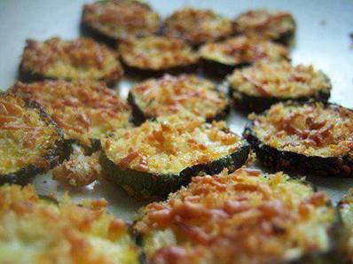 I may be addicted to Zucchini!!!
Zucchini Parmesan Crisps - Be sure to click on the word Share to save this to your wall.

1 lb. zucchini or squash (about 2 medium-sized)
1/4 cup shredded parmesan (heaping)
1/4 cup Panko breadcrumbs (heaping)
... 1 tablespoon olive oil
1/4 teaspoon kosher salt
freshly ground pepper, to taste
Preheat oven to 400 degrees. Line two baking sheets with foil and spray lightly with vegetable spray.

Slice zucchini or squash into 1/4 inch-thick rounds. Toss rounds with oil, coating well.

In a wide bowl or plate, combine breadcrumbs, parmesan, salt and pepper.

Place rounds in parmesan-breadcrumb mixture, coating both sides of each round, pressing to adhere. The mixture will not completely cover each round, but provides a light coating on each side.

Place rounds in a single layer on baking sheets. Sprinkle any remaining breadcrumb mixture over the rounds.

Bake for about 22 to 27 minutes, until golden brown. (There is no need to flip them during baking -- they crisp up on both sides as is.)
for more yummy recipes many more here
http://www.facebook.com/groups/healthylifeweightloss/